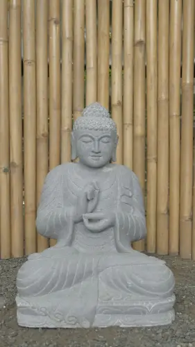 Product image of the product “Seated Buddha made of Riverstone in Dharmachakra position - gesture of wheel of the teaching of Dharma. About 61cm height. ”